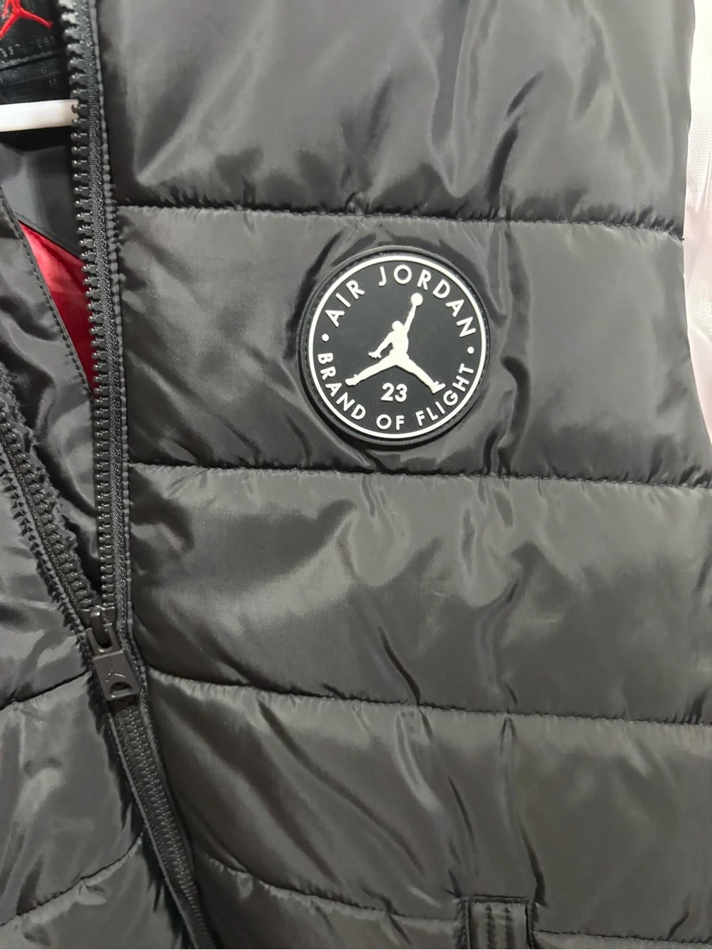 Jordan Black Quilted Vest with White Sleeves & Red Accents
